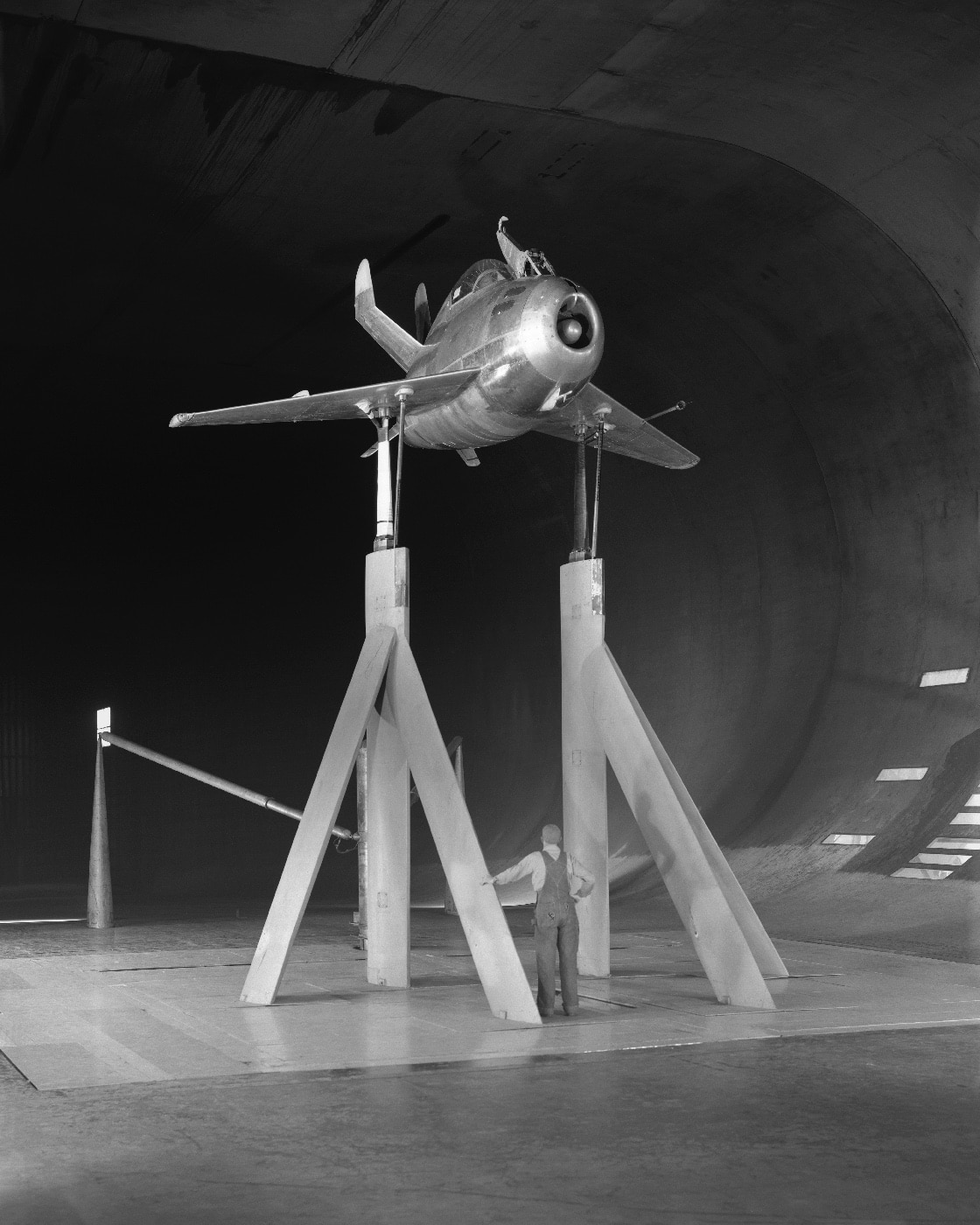 A test model of the McDonnell XP-85 is displayed, representing the early stages of parasite fighter research. Designed to be carried and deployed by large bombers, the XP-85 was the world’s smallest jet-powered aircraft at the time. The model demonstrates the precision and challenges faced in creating a functional, compact fighter jet. This innovative design marked a bold step in experimental aviation during the post-WWII period.