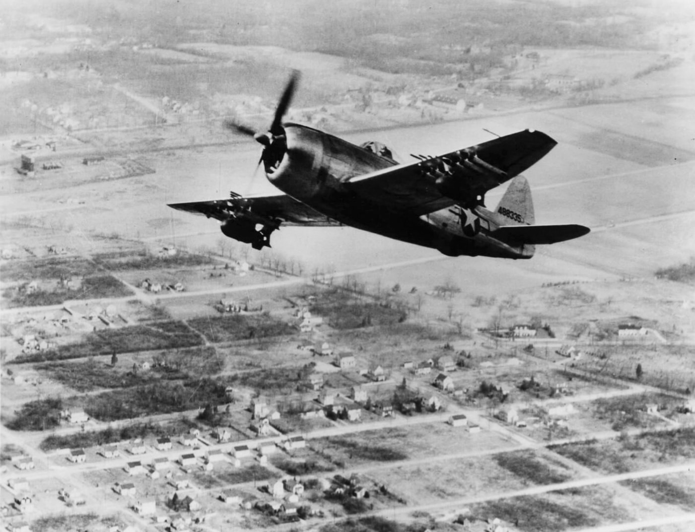 A Republic P-47 Thunderbolt is caught mid-flight, its massive radial engine roaring like an airborne lion. With wings spread wide and its sleek canopy gleaming, it feels like the superhero of aviation. The turbocharger hums along, making altitude gains a breeze — or at least a lot of compressed air. This bird was built tough, like the 1940s version of a muscle car in the sky!