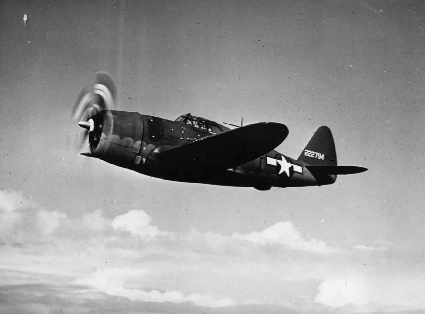 The Republic P-47D Thunderbolt is flying high, looking like it owns the entire sky. You can almost hear the Pratt & Whitney R-2800 growling, ready to take on anything that dares cross its path. This is not just a plane — it’s a flying fortress with attitude and a whole lot of .50 caliber persuasion. The kind of plane that says, “I’ll get you there and back — unless you’re the enemy, in which case, good luck!”