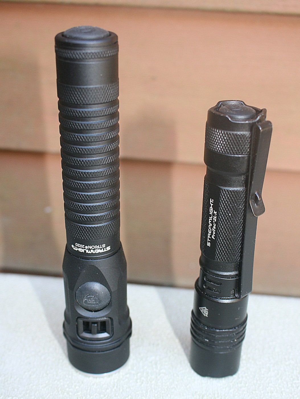 The Streamlight Strion 2020 and ProTac 2L-X are both high-quality flashlights designed for different needs. The Strion 2020 is a rechargeable, high-performance option delivering up to 2,000 lumens, ideal for professional and tactical use with its ergonomic design and rugged durability. In contrast, the ProTac 2L-X is a compact, dual-fuel flashlight with a 500-lumen output, offering portability and versatility for everyday carry and outdoor activities. While the Strion 2020 shines in demanding environments, the ProTac 2L-X excels as a lightweight, flexible option for general use. Both exemplify Streamlight's commitment to quality and dependability.