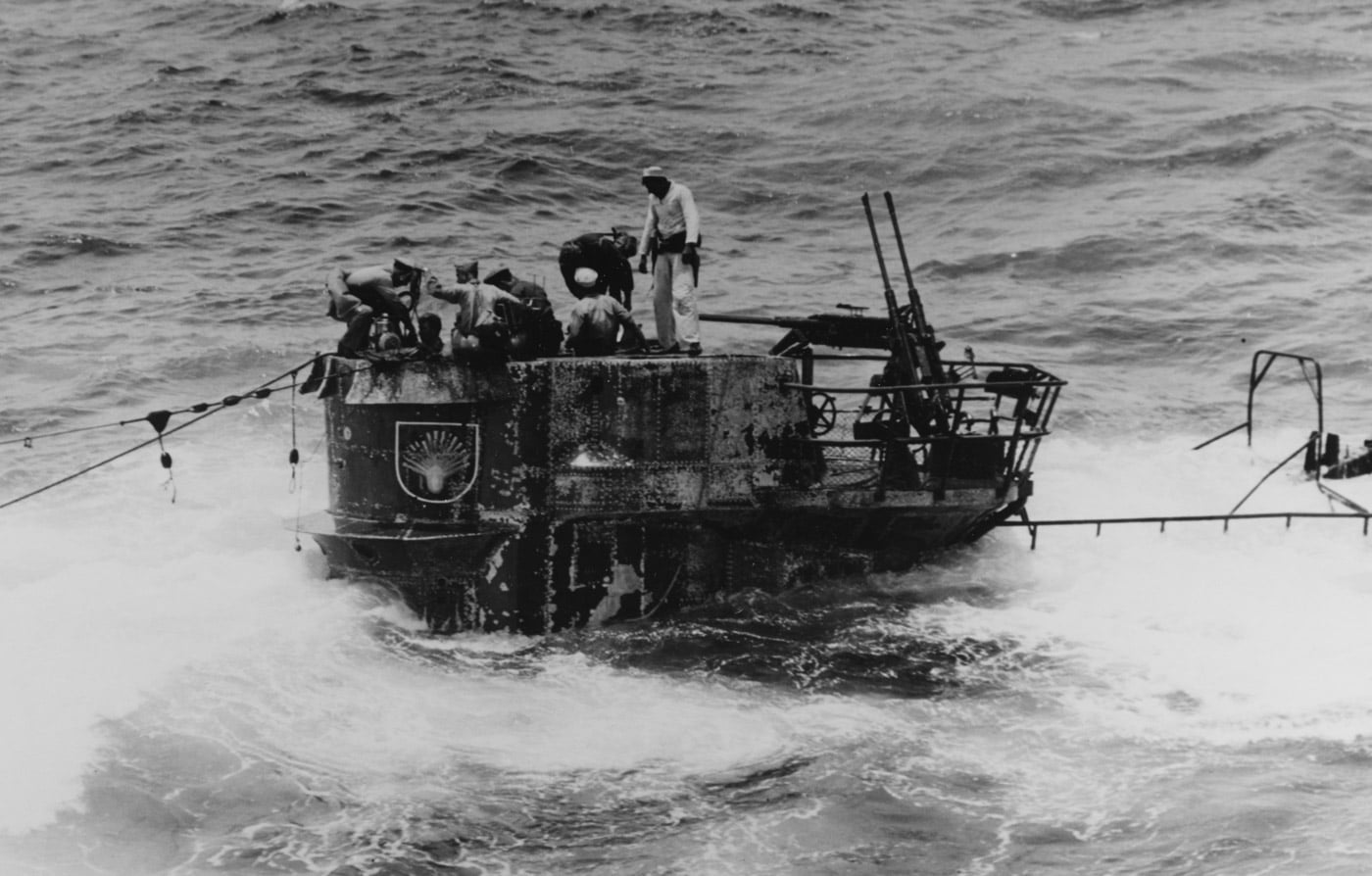 US Navy boarding crew works to pump out water from U-505