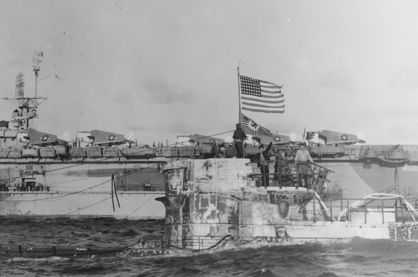 US flag flies over U-505 with USS Guadalcanal in background