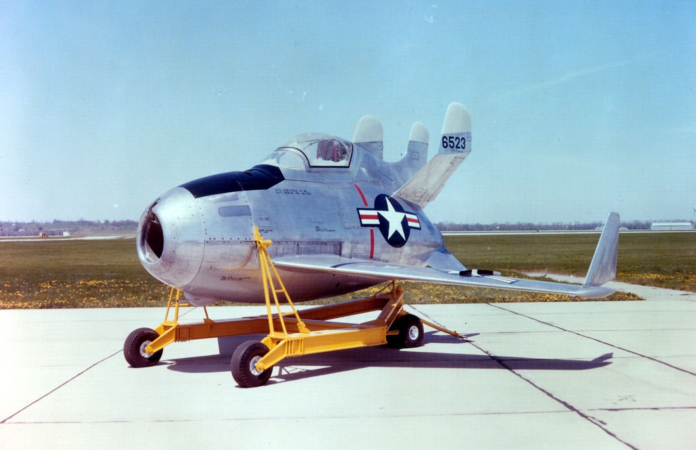 The McDonnell XF-85 Goblin is displayed at Wright-Patterson Air Force Base in Dayton, Ohio. This small, egg-shaped aircraft, with its short wings and streamlined fuselage, was developed as a parasite fighter to be launched mid-air from large bombers. The image highlights its compact design, which was intended to allow easy housing inside bomber bays. This experimental jet represents the U.S. Air Force's innovative efforts to protect long-range bombers during Cold War missions.