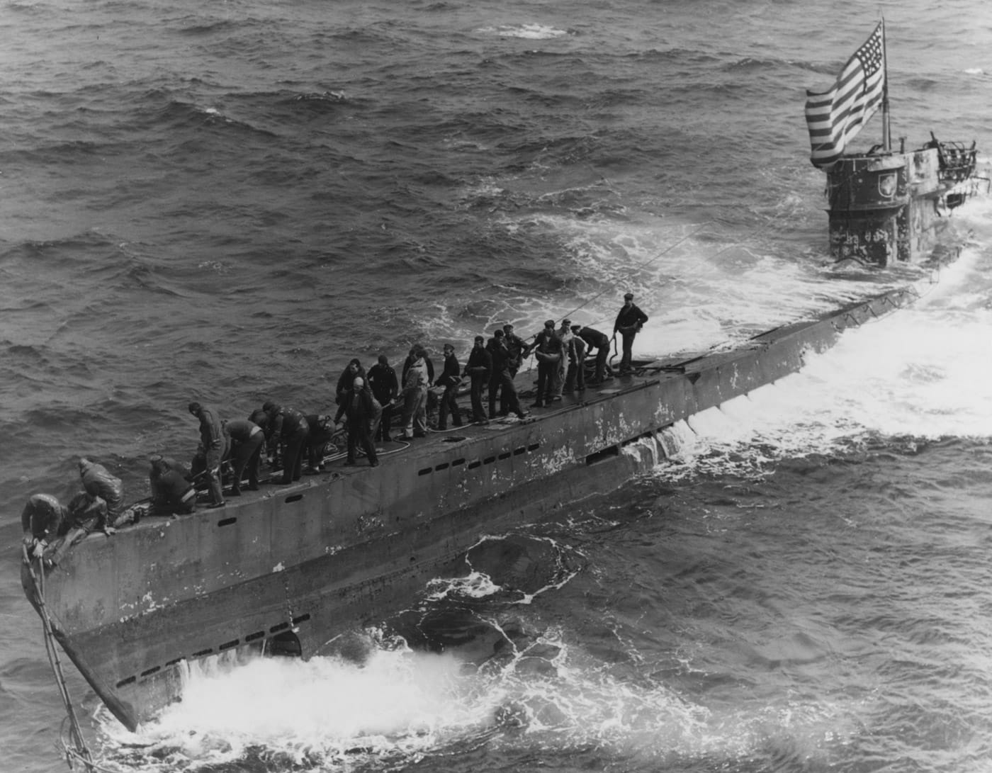 boarding party from USS Pillsbury securing tow lines to U-505