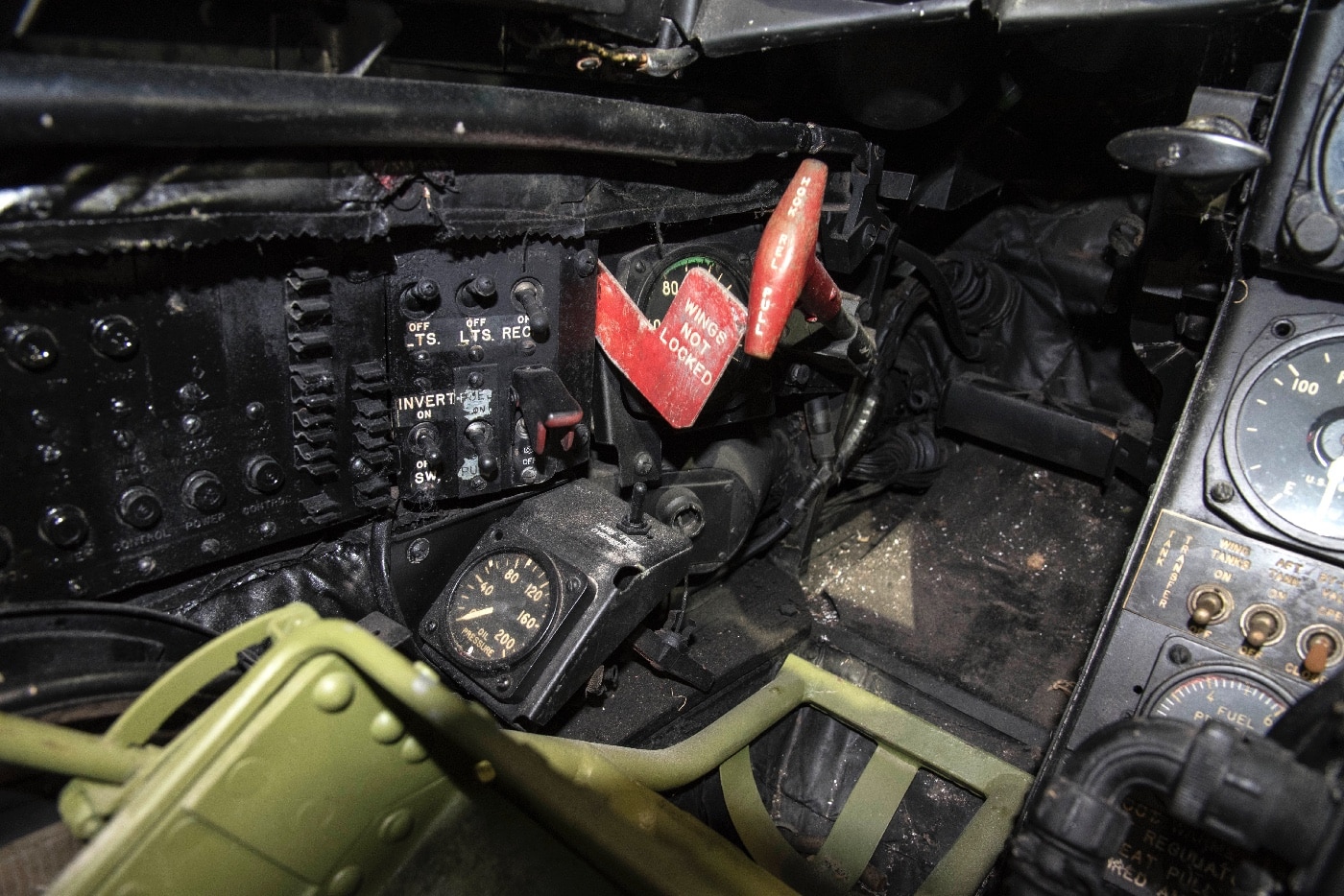 A detailed close-up of the wing and hook controls in the cockpit of the XF-85 Goblin parasite fighter. These controls were used by the pilot to manage the aircraft’s small folding wings and docking hook for mid-air attachment to the B-29 bomber. The intricate levers and switches reflect the precision required for a successful retrieval operation. This image highlights the advanced and innovative engineering of late-1940s military aviation.