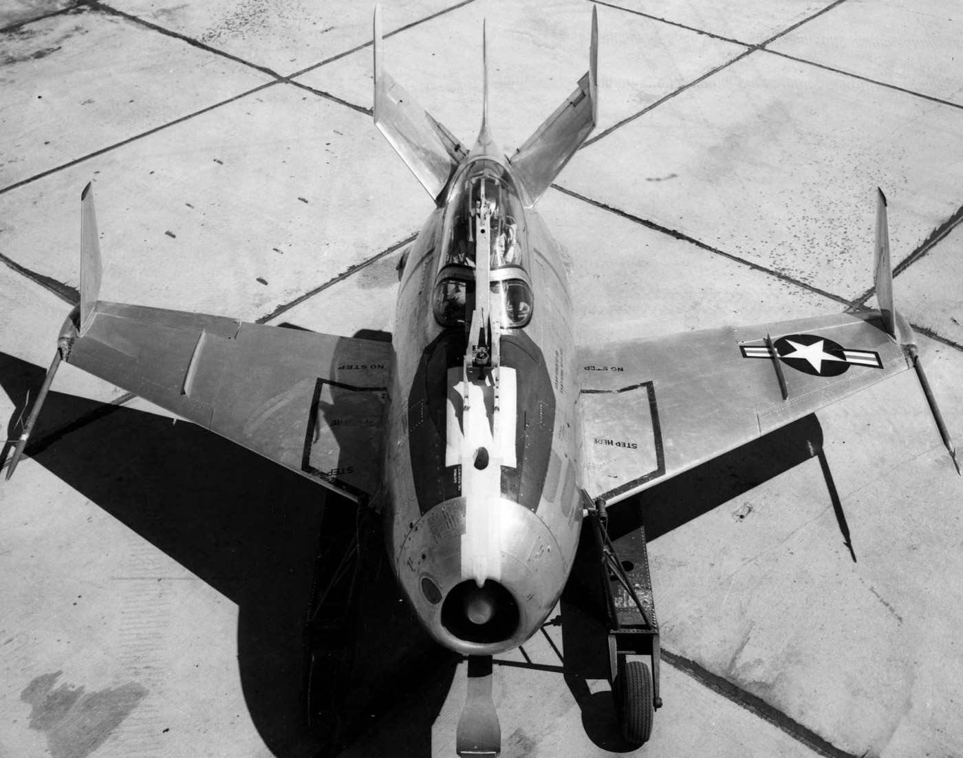 This photo shows the first McDonnell XF-85 Goblin built, with clear visibility of the vertical winglets at the ends of its short wings. These winglets were designed to enhance stability and control for the compact, egg-shaped jet during flight. As a parasite fighter, the Goblin needed precise handling to connect and disconnect mid-air from its bomber host. The image highlights the careful engineering and innovative design of this experimental 1940s aircraft.