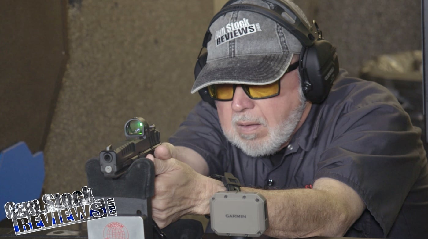 A photograph of the author shooting Speer Gold Dot G2 9mm ammunition at a shooting range. The author is using a Springfield Armory Echelon pistol equipped with a red dot sight for precision aiming. The handgun is stabilized on a shooting rest to eliminate shooter error and ensure consistent testing conditions. The range environment is visible in the background, with safety equipment and targets in place. The setup highlights a controlled evaluation of the ammunition's accuracy, reliability, and performance.