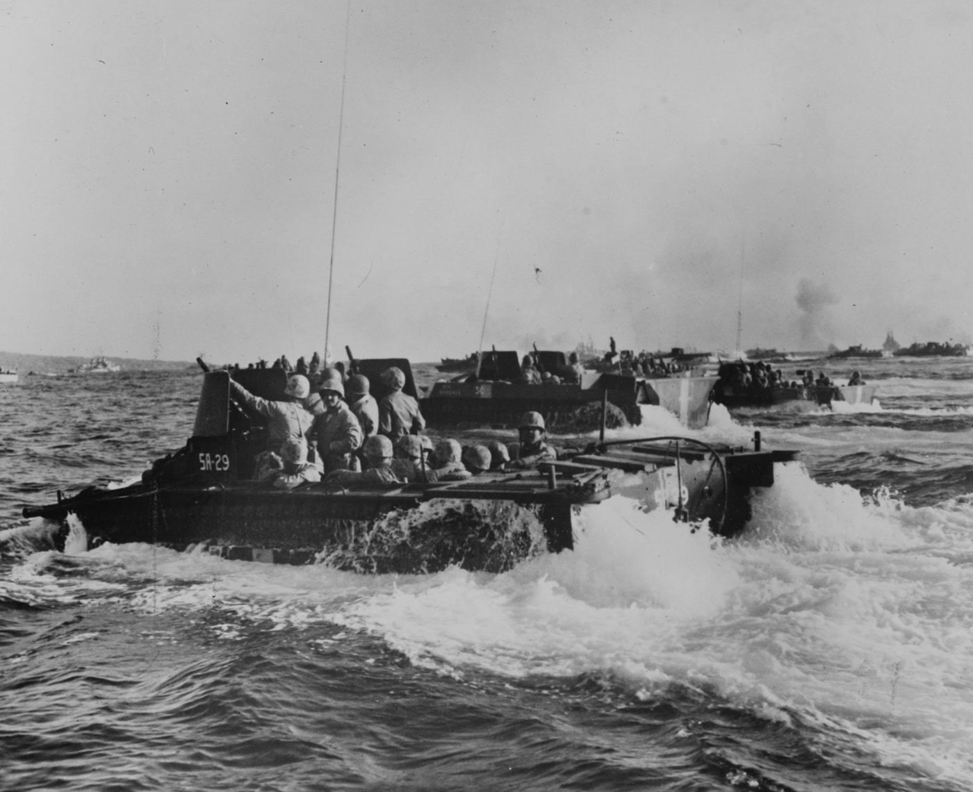 LVT AMTRACs loaded with Marines approach Iwo Jima 1945 Pacific War