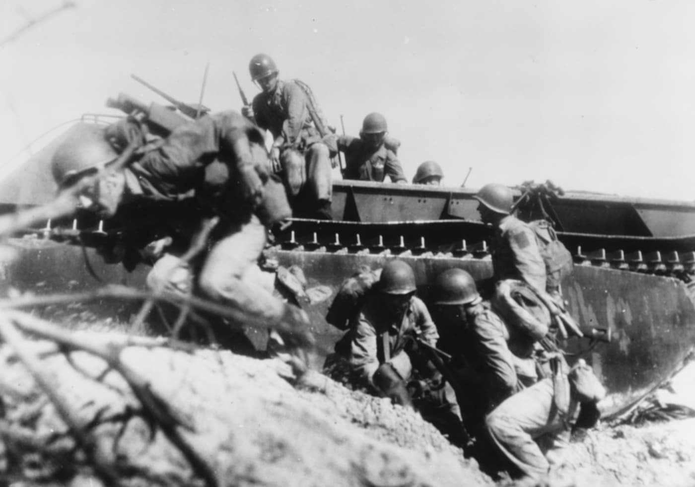 Marines jump out of an LVT during the invasion of Guam in July 1944