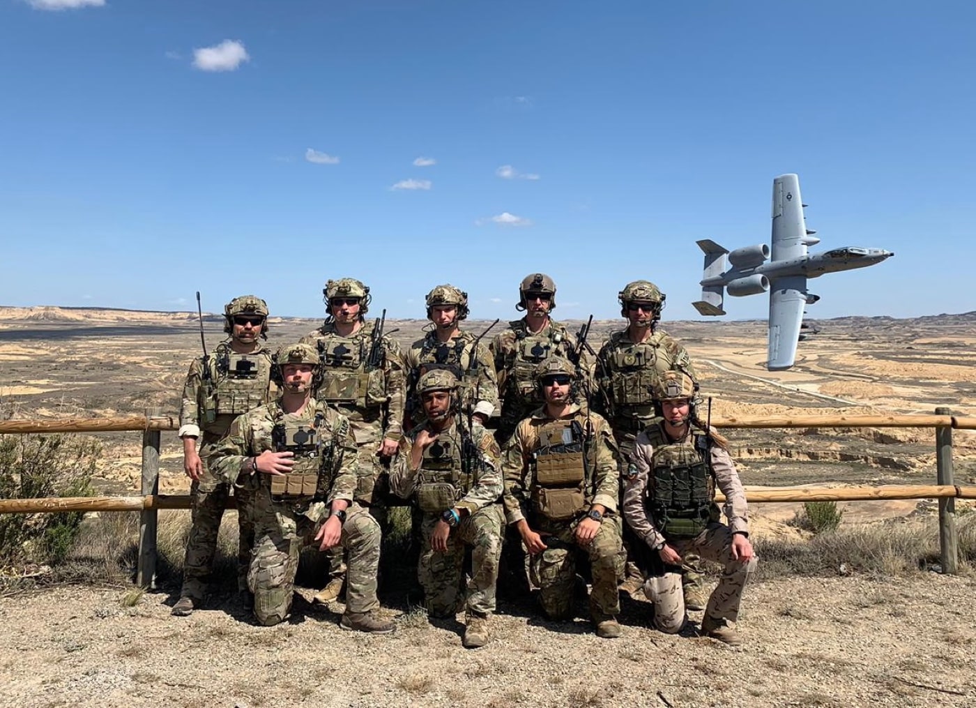 USAF JTAC team with A-10 Warthog flying behind them