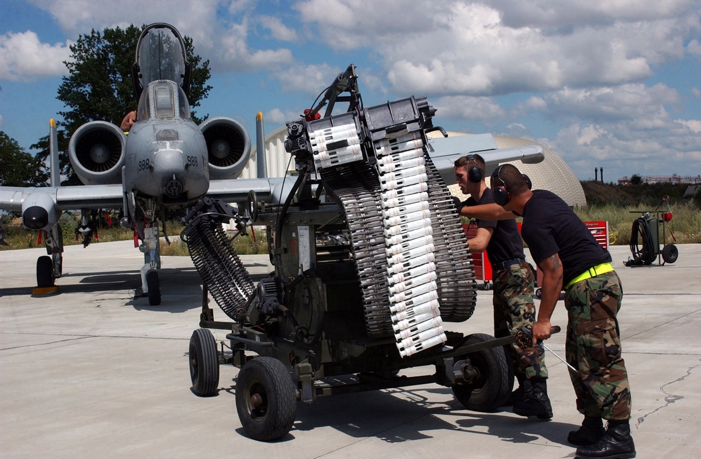 USAF airmen load 30mm rounds into the GAU-8 autocannon on an A-10 Warthog