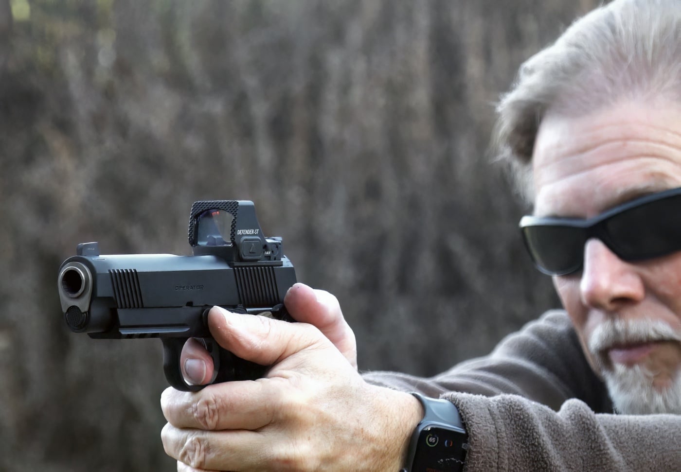 author shooting the Springfield 1911 Operator AOS during review