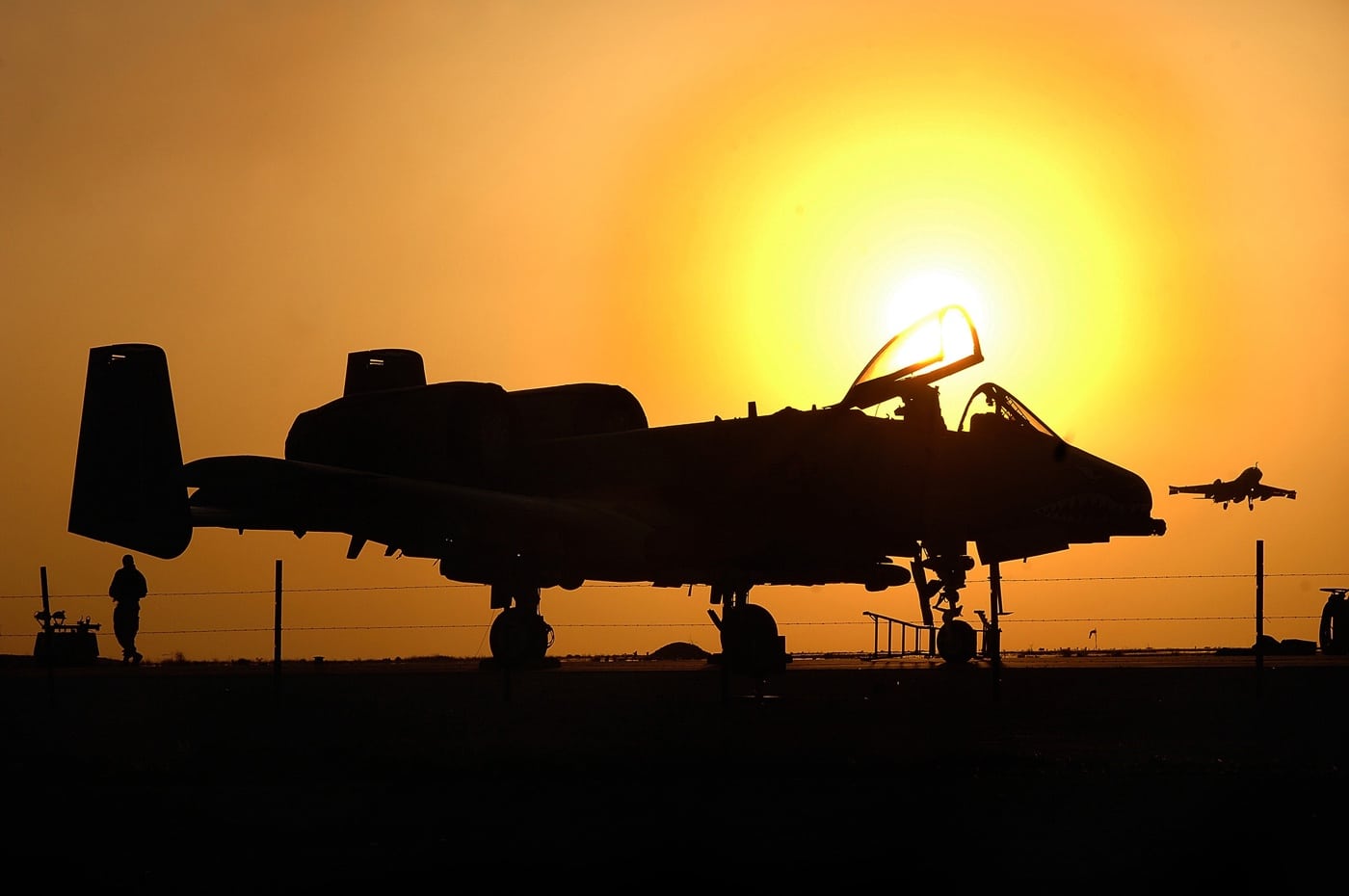 ground team works on A-10 after flying missions in Iraq