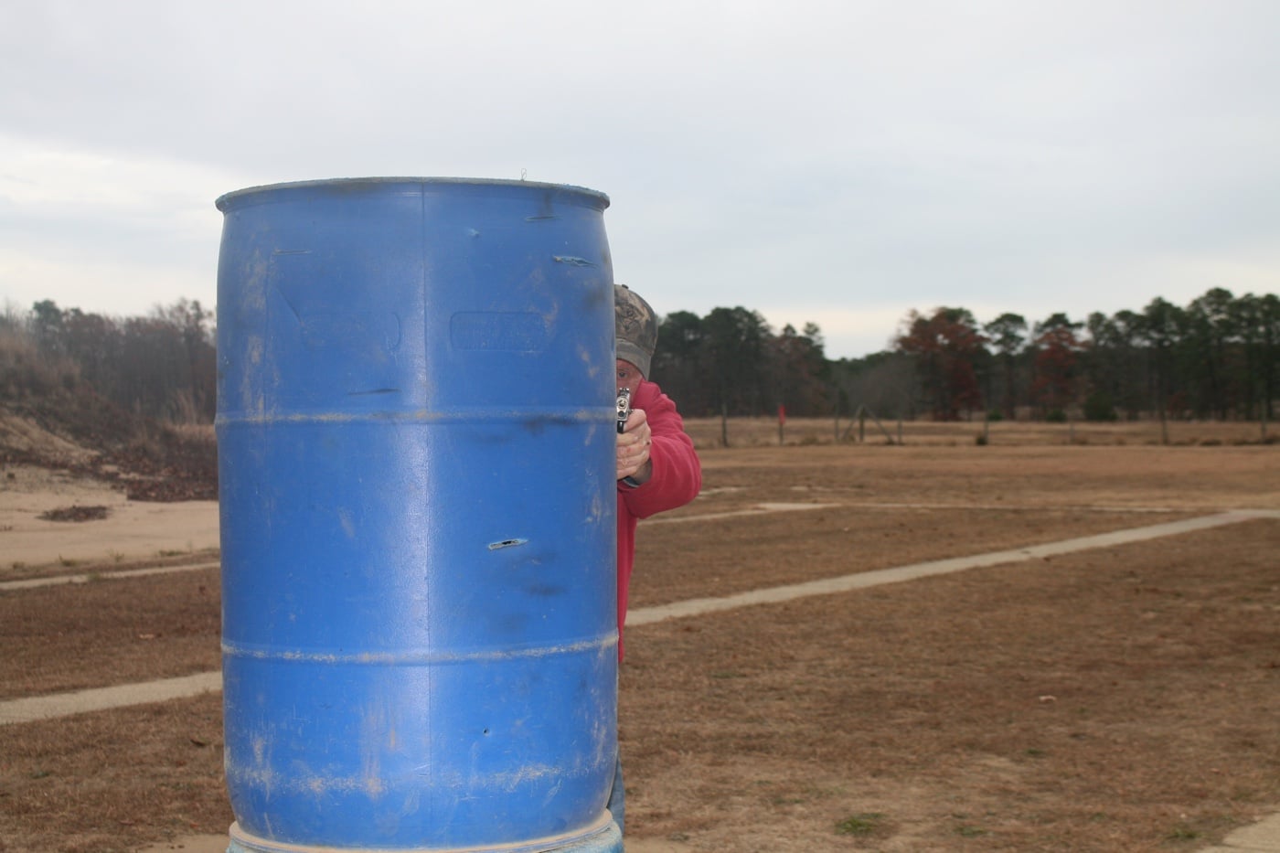 using a barrel for cover during firearms training