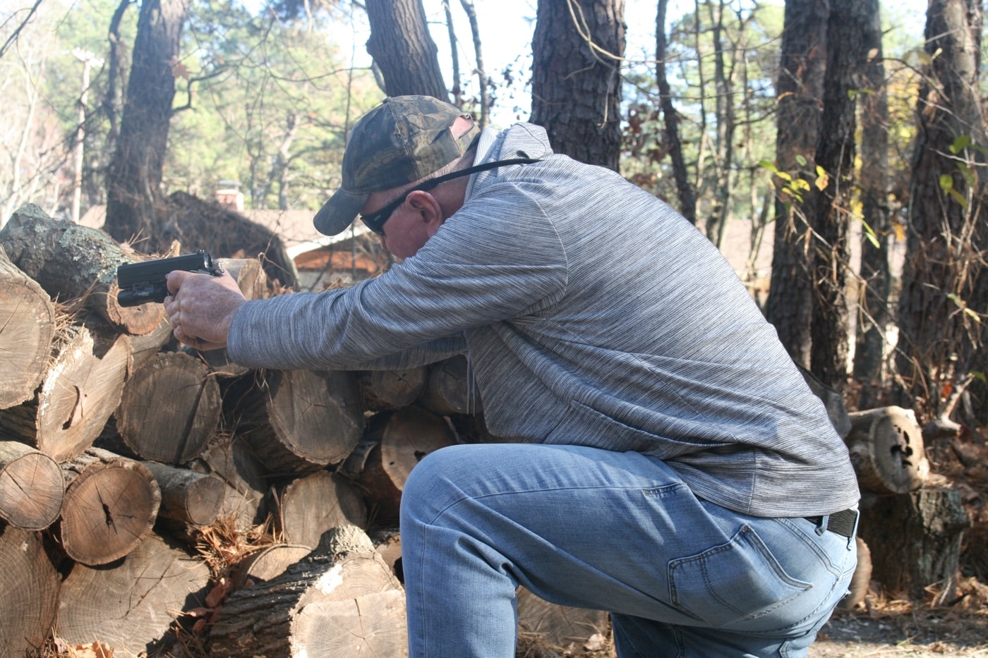 using a woodpile for cover in a gunfight