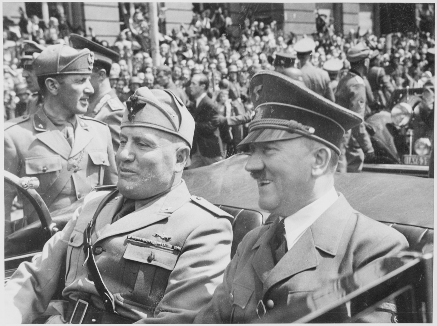 Benito Mussolini and Adolph Hitler ride in a car in Munich Germany