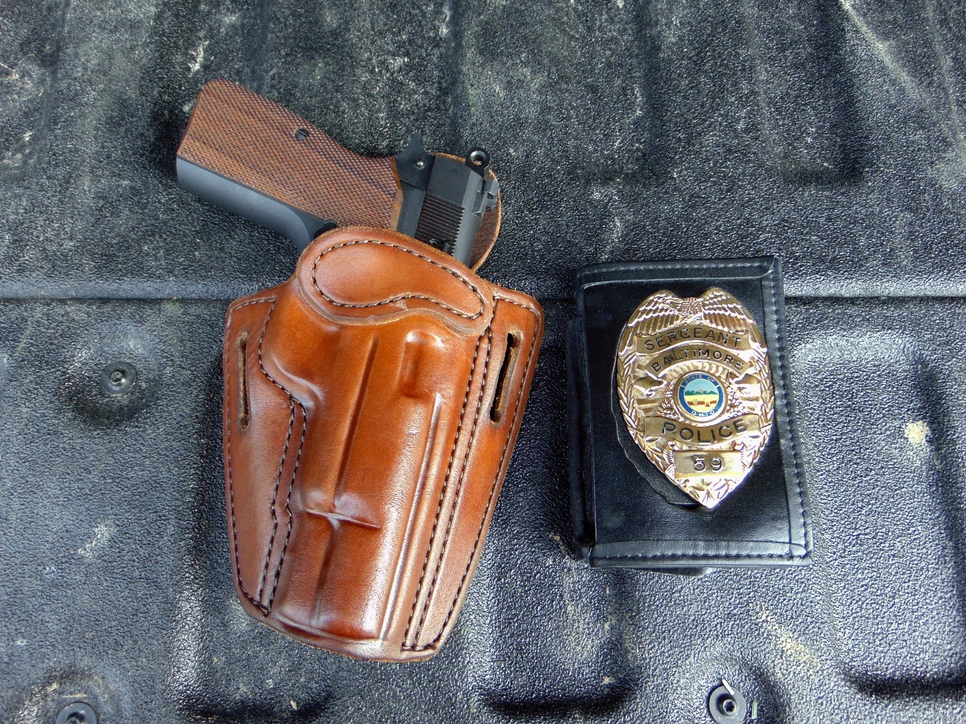 Burdette Custom Holsters Detective leather OWB CCW holster with Springfield Armory SA-35 semi-automatic pistol and police badge