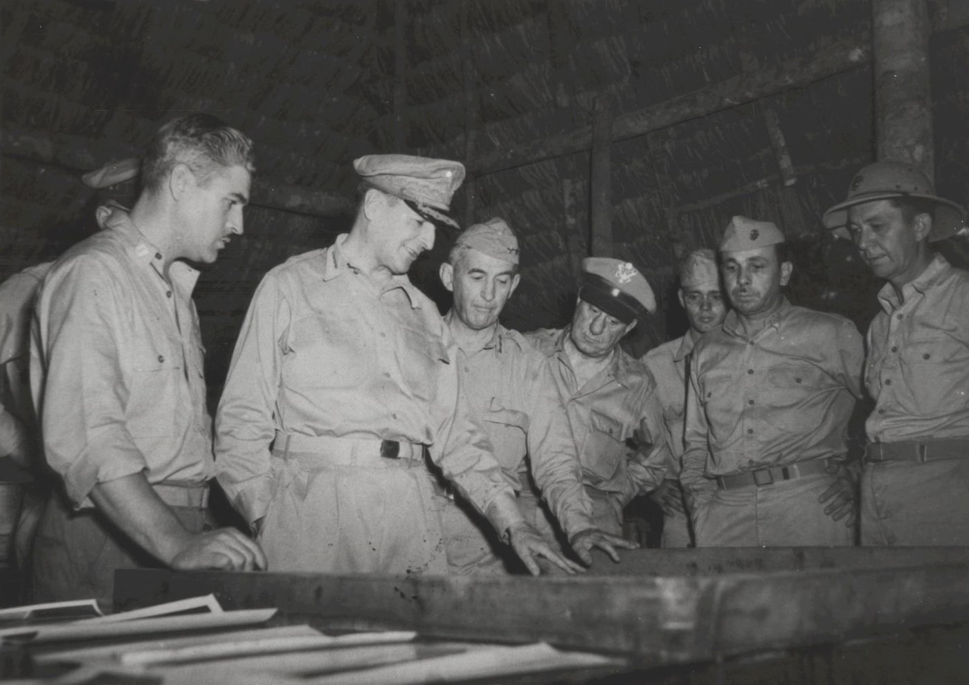 General Douglas MacArthur studies map during planning for Battle of Cape Gloucester