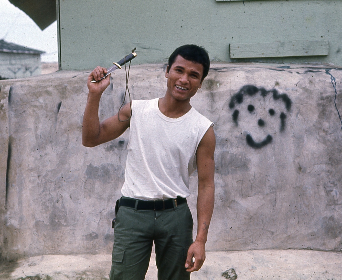 Indigenous soldier with Recon Team Connecticut holds SOG knife photo Jason Hardy