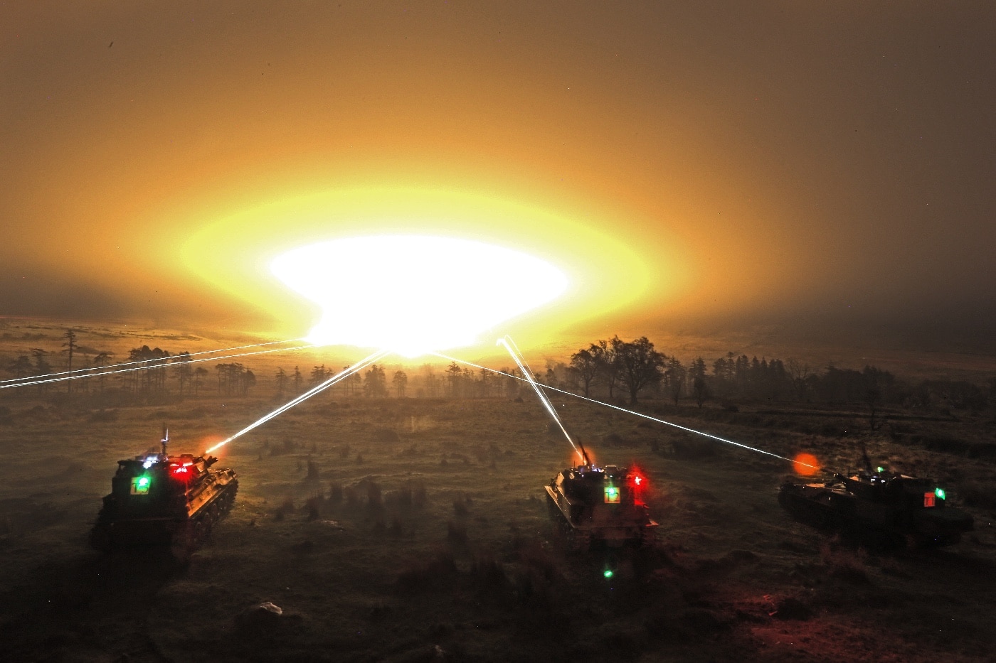 Irish FV101 Scorpion tanks engage a target during night training