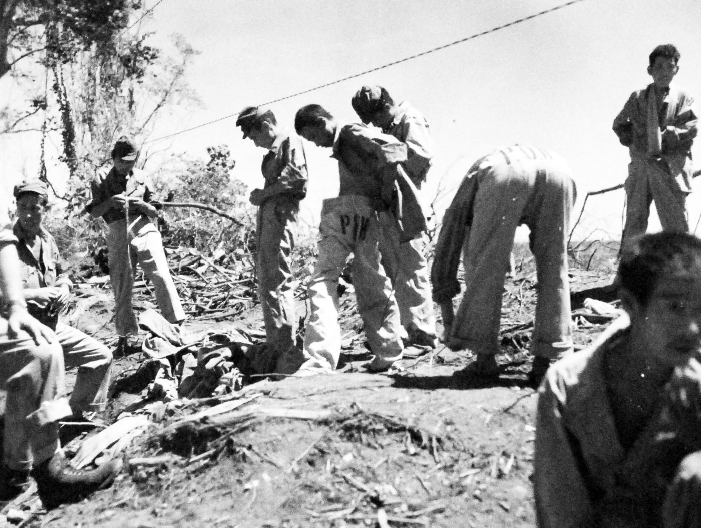 Japanese POWs are given new clothes