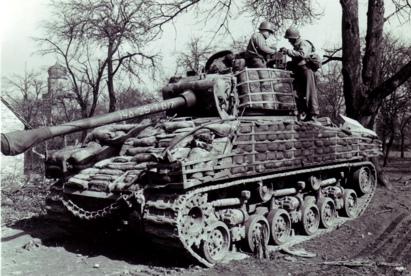 M4A3E8 tanks with 14th Armored has sandbags and other up armor