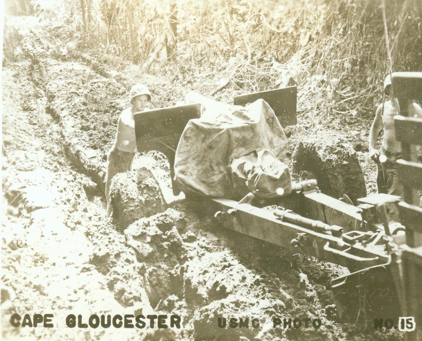 Marines fight the mud on Cape Gloucester when towing artillery