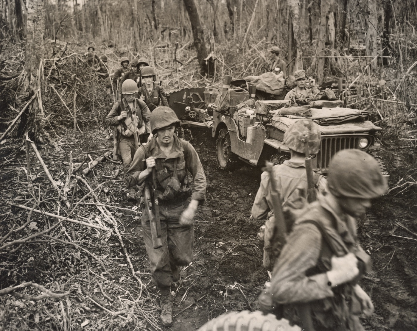 Marines move off the line for a break in the fighting on Cape Gloucester