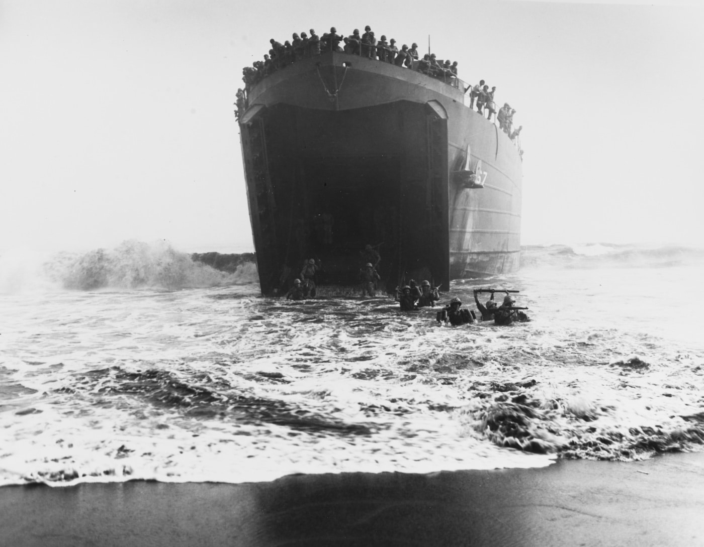 Marines wade ashore at Cape Gloucester from LST-67