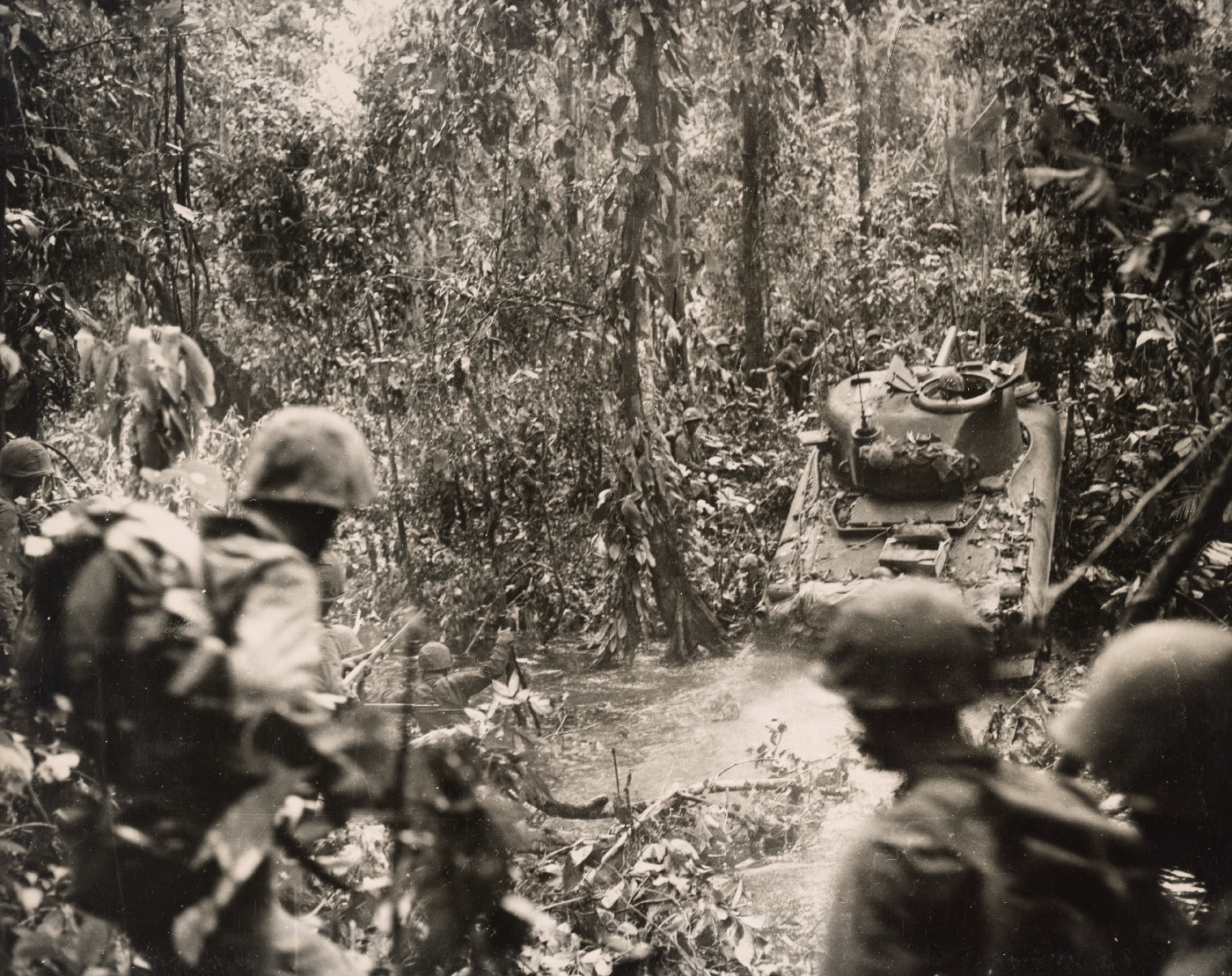 Sherman tank crosses stream to engage Japanese on Cape Gloucester