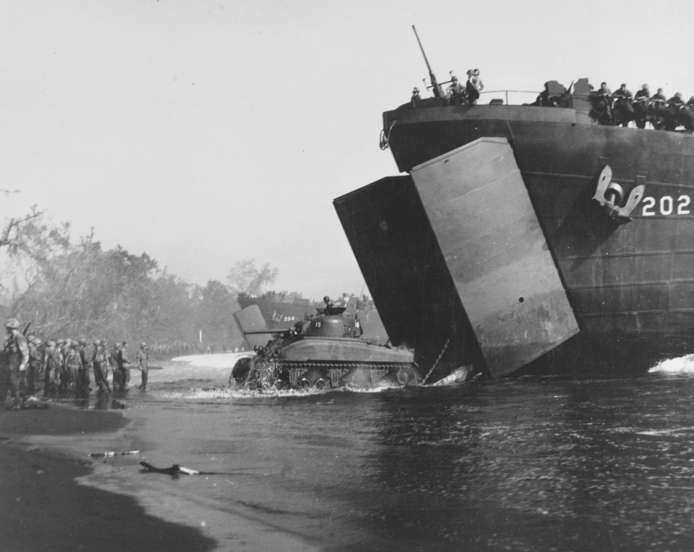 USMC M4 Sherman tank rolls off LST or Landing Ship Tank