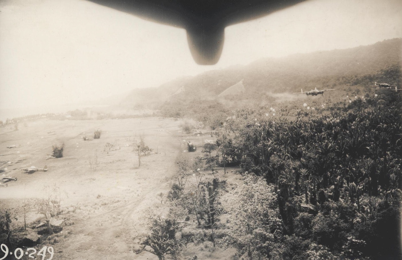 squadron of North American B-25 Mitchell medium bombers attacks Cape Gloucester airfield