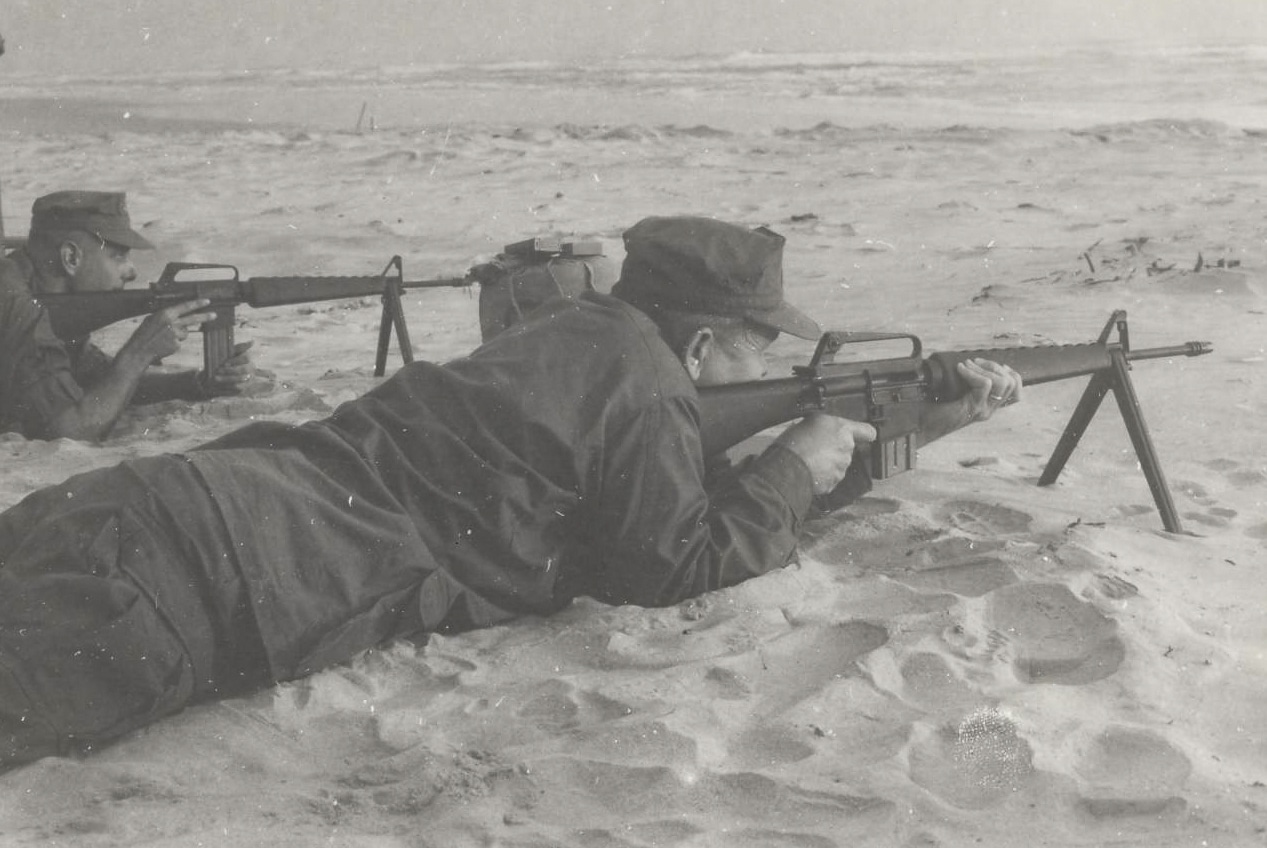 Colonel Edwin Reed learns how to shoot the M16