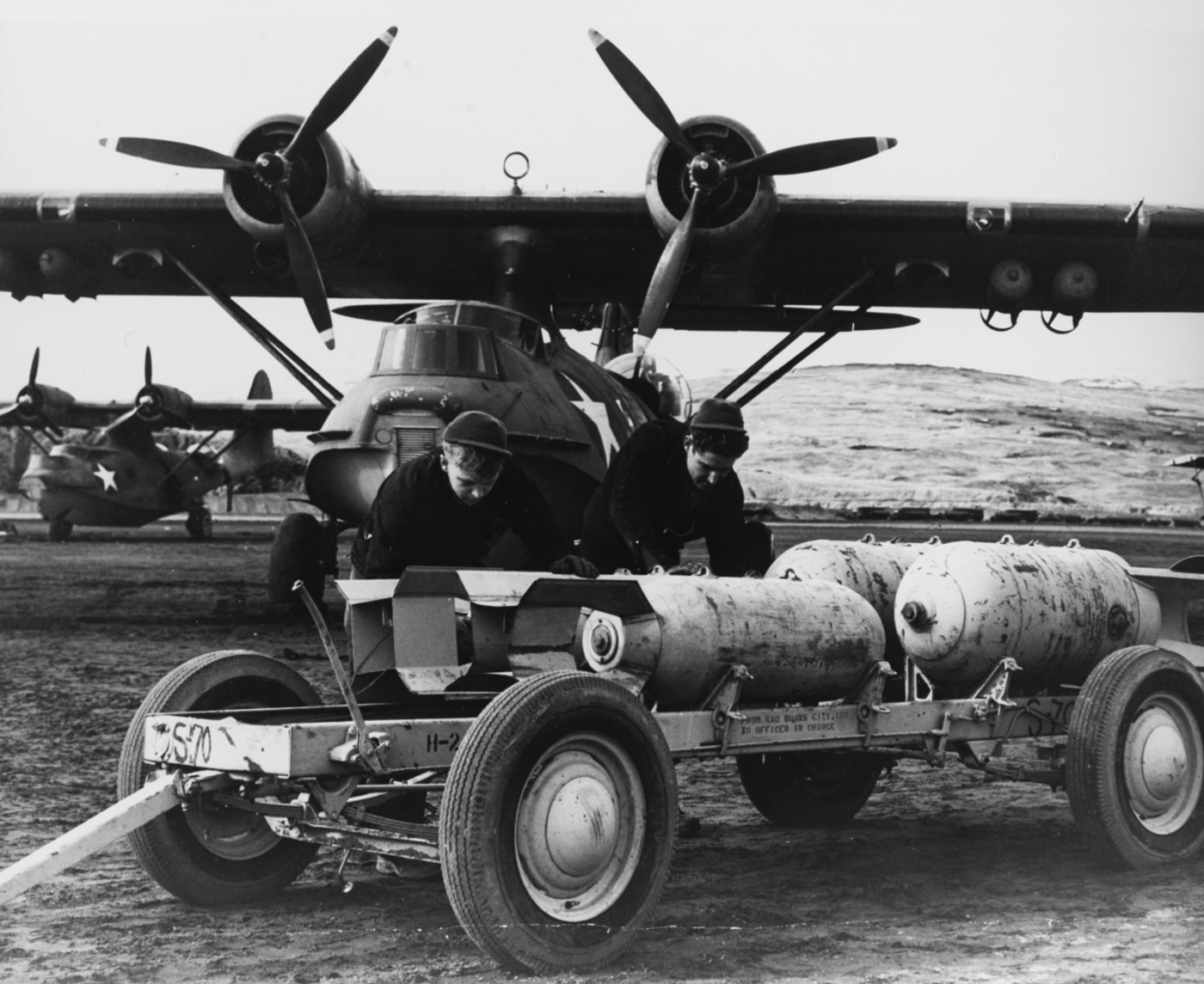 Mark 37 depth bombs loaded onto Consolidated PBY-5A patrol bombers in Aleutian Islands