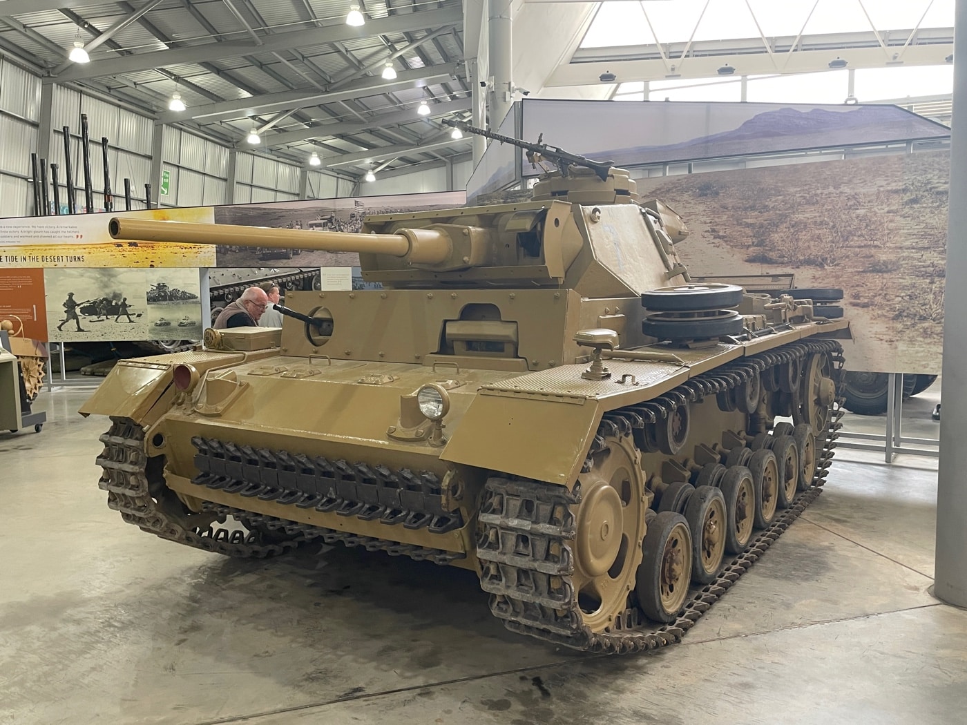 The image shows a German Panzer III tank, also known as Panzerkampfwagen III or pz iii, displayed in the historic Bovington Tank Museum. The tank’s preserved turret, main armament, and steel armor provide a tangible glimpse into the engineering prowess of Rheinmetall and the Wehrmacht’s armored forces during World War II. As a key asset of the panzer divisions, it stands alongside iconic vehicles such as Panzer IV tanks and stug iii assault guns that defined the era of blitzkrieg tactics. The exhibit emphasizes the evolution of armored warfare, evoking memories of significant battles like Kursk and Stalingrad. Detailed features, including the turret ring and assembly line craftsmanship, underscore the enduring legacy of German mechanized troops in modern military history.