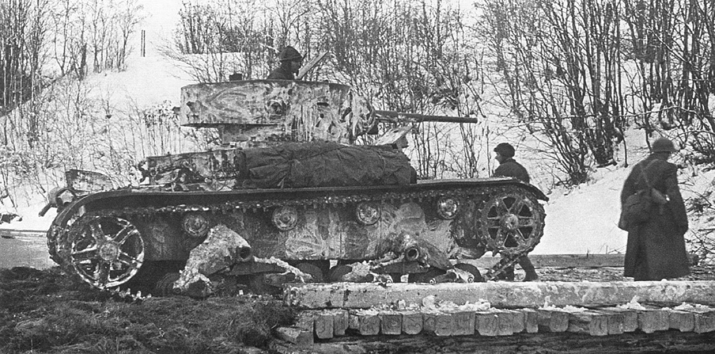 In this photo, a Russian T-26 tank crosses a light bridge during winter fighting in the snow. The lightly armored vehicle could not go toe to toe with modern tanks, but it was light and maneuverable.