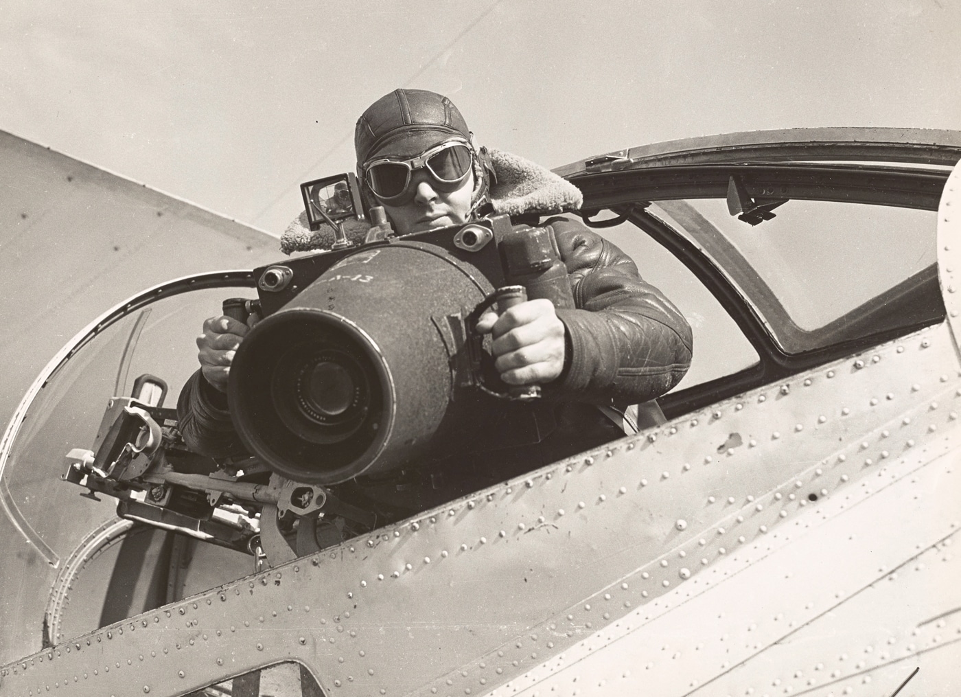 US Coast Guard combat photographer Eldon Ashcroft with camera in PBY Catalina