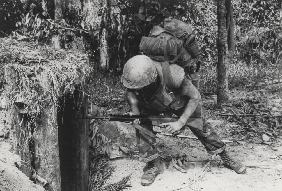 US Marine checks a VC bunker in Vietnam War