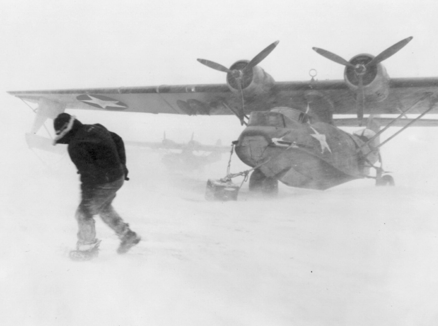 snow blows around PBY at US base on Adak Island Aleutian Islands Alaska