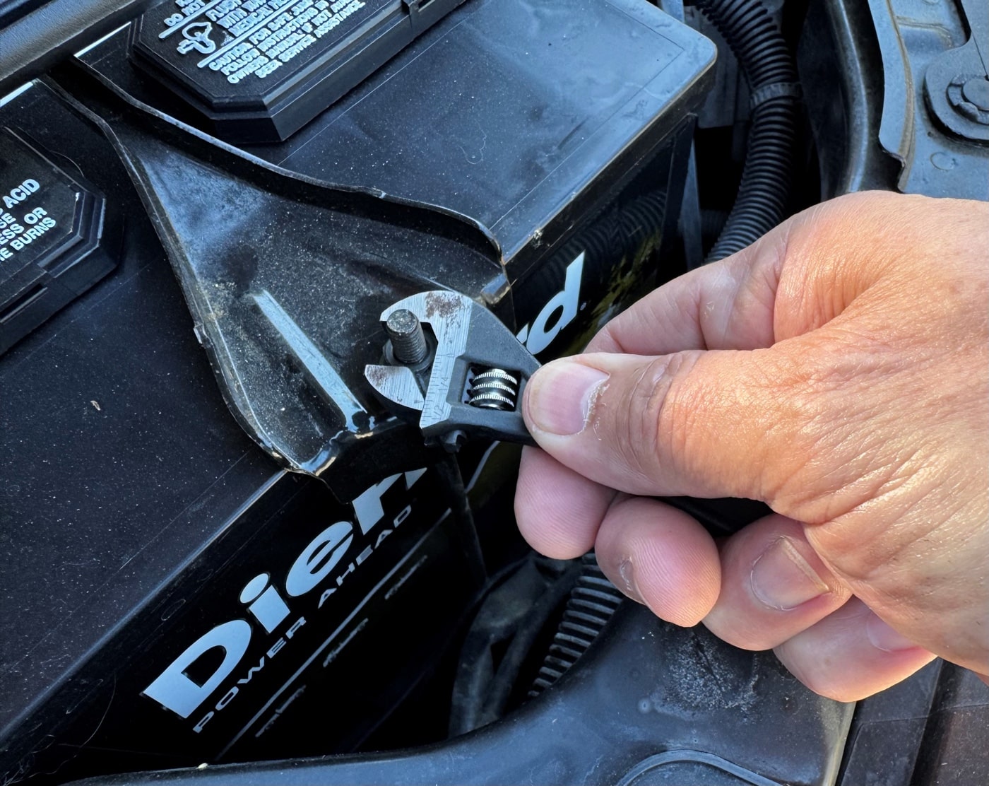 using an EDC wrench for a car repair